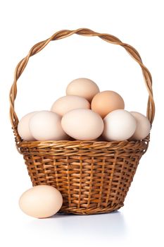 Fresh chicken eggs in basket on white background