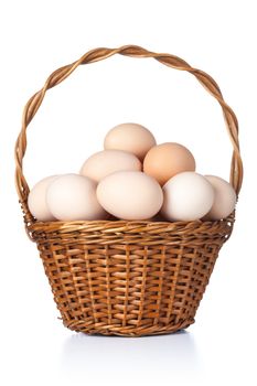 Chicken eggs in basket on white background