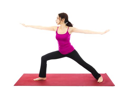 Woman doing Warrior II Pose during Yoga (Series with the same model available)