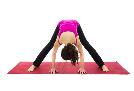 Woman doing Wide Legged Forward Bend in Yoga (Series with the same model available)