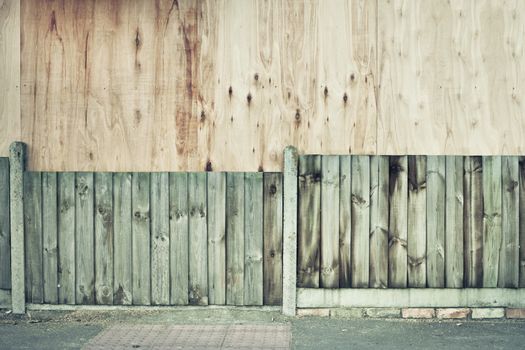 Wooden fence and plywood board as a background