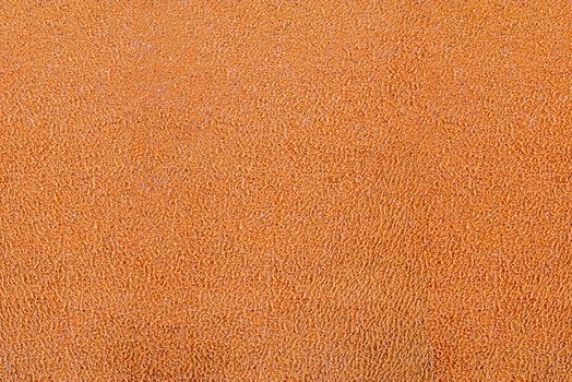 Closeup of orange fabric texture for background