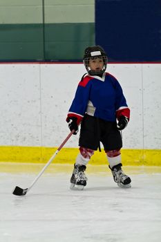 Young hockey player in an arena