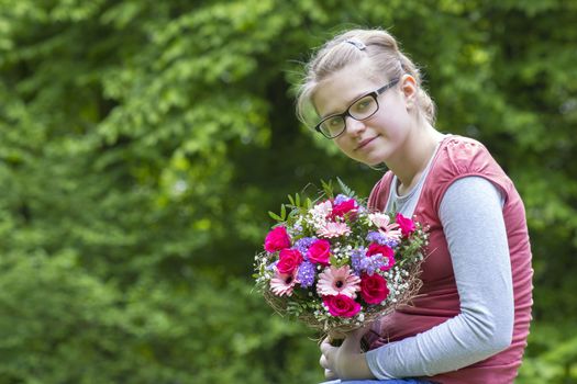 portrait of a beautiful young girl with flowers