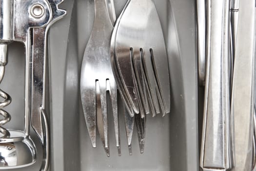 Close up of stainless steel forks in a drawer