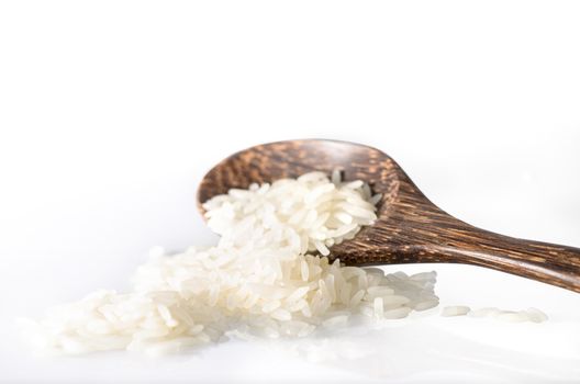 rice cereal and wooden spoon on white background with clipping path  :  Selective Focus