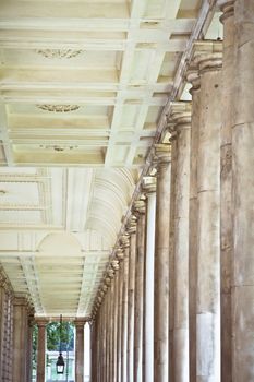 Row of pillars and decorated roof in a classic building in London