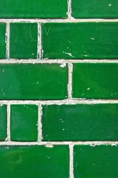 Close up of a green brick wall as a background