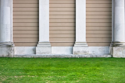 Pillars against a stone wall as a background