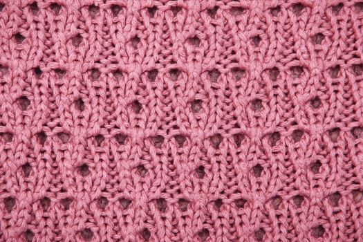 Close up of knitted pink wool as a background