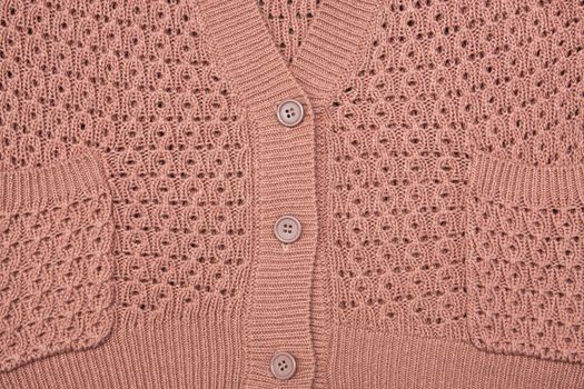 Buttons and breast of a wool cardigan