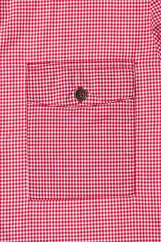 Pocket on the front of a red gingham ladies' blouse