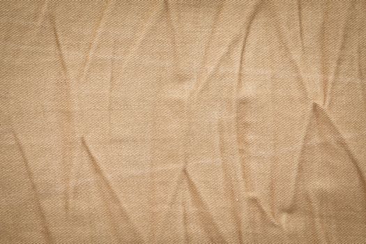 Creased khaki denim material as a background