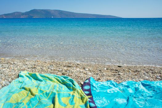 Towels on a pebble beach in summer