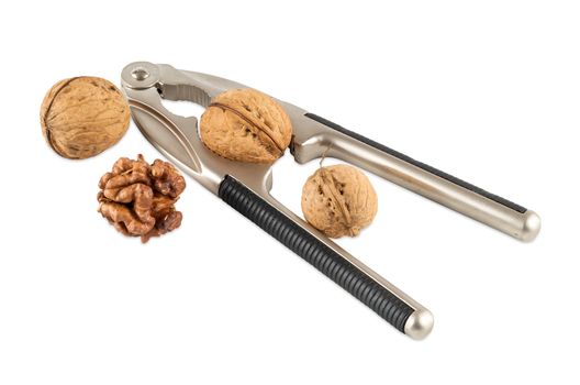 Walnuts with nutcracker isolated on white background with clipping path