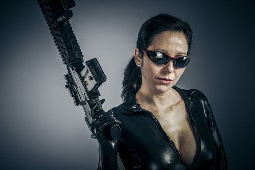 Erotic, Sexy girl military woman posing with guns.