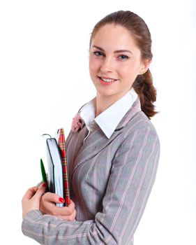 Portrait of university girl holding books and smiling. Isolated over white background.