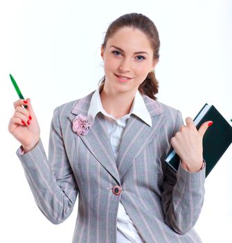 Portrait of university girl holding books and smiling. Isolated over white background.