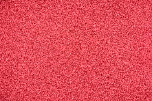 Red synthetic chair covering material as a background