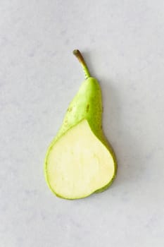 Slice of a pear  on a red background
