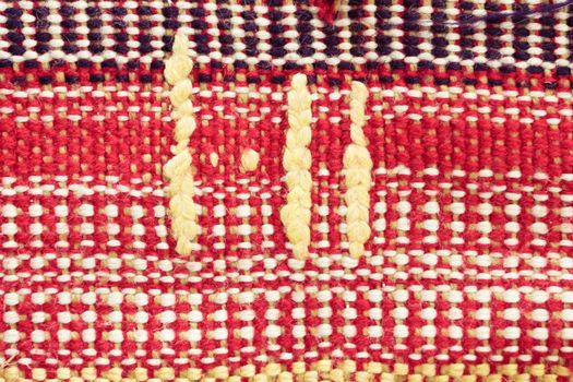 Close up of the pattern on a wool rug as a background