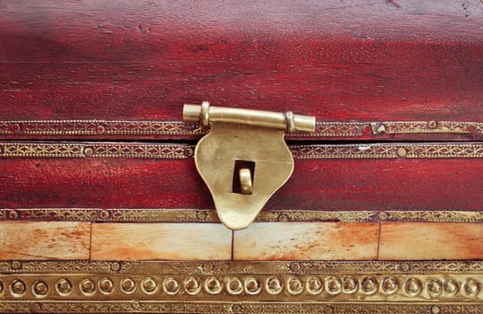 Close up of the latch of a wooden box