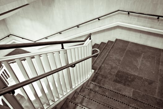 A modern interior staircase in monochrome tones