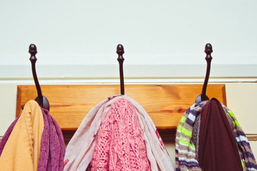 Clothes and scarves hanging on hooks