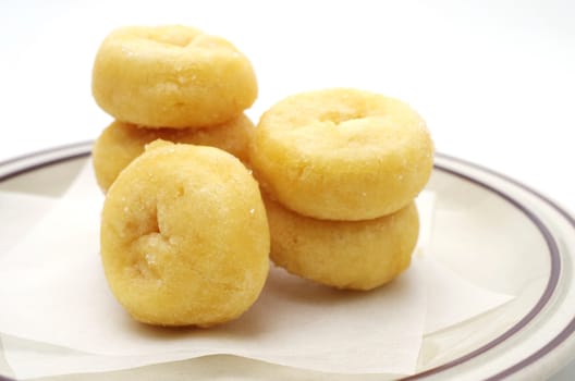 Donuts in dish with white background