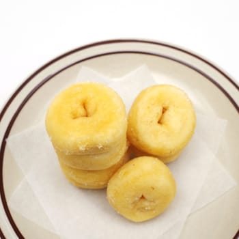 Donuts in dish with white background