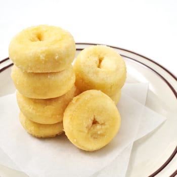 Donuts in dish with white background