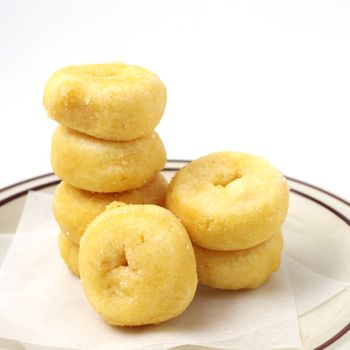 Donuts in dish with white background