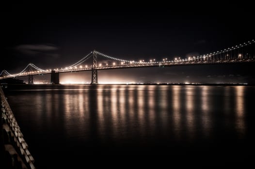 Suspension bridge lit up at night, Bay Bridge, San Francisco Bay, San Francisco, California, USA