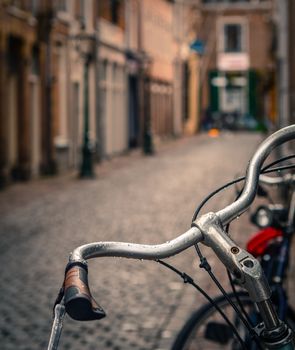 Scene Of A Bicycle In The Rain On A Cobbled European Backstreet