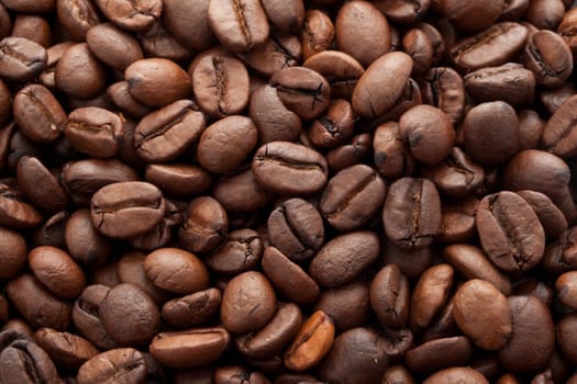 Close-up of brown coffee beans, background texture