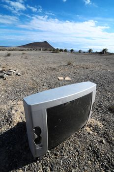 A Broken Gray Television Abandoned in the Desert