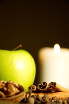 Green apple, cinnamon, walnut and a candle