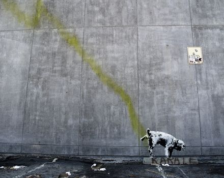 LOS ANGELES, USA - OCTOBER 17: Banksy graffiti on a wall (Pissing dog) on October 17, 2011 in Los Angeles. Banksy's first film, Exit Through the Gift Shop, was nominated for the Academy Award.