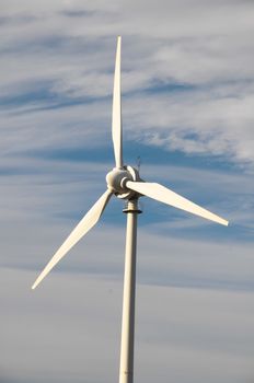 Eletric Power Generator Wind Turbine over a Cloudy Sky