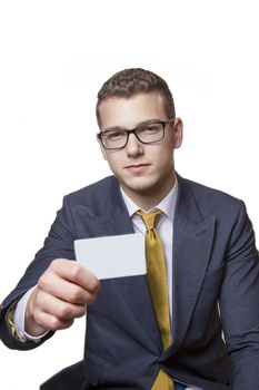 Businessman holding up white Businesscard with copy space