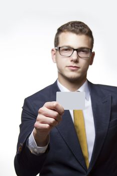 Businessman holding up white Businesscard with copy space