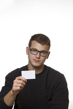 Young welldressed worker or mechanic presenting his business card