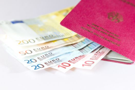 Several Euro-Notes lying in a german passport for traveling