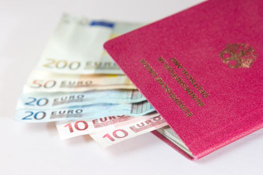 Several Euro-Notes lying in a german passport for traveling