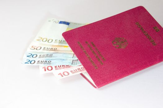 Several Euro-Notes lying in a german passport for traveling