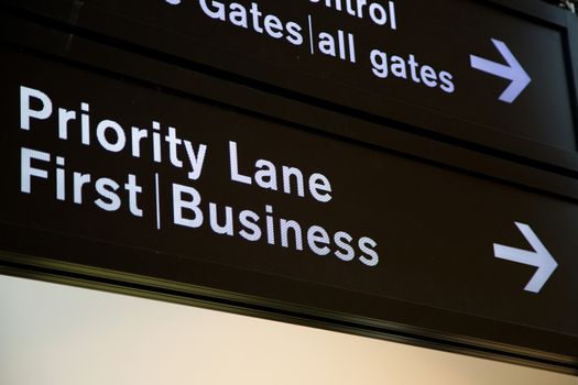 Airport departure board in terminal with flight information