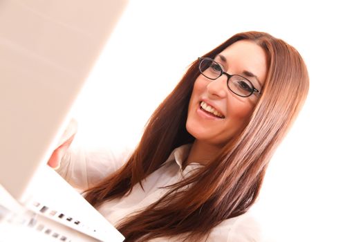 Cheerful business woman working on a Laptop.