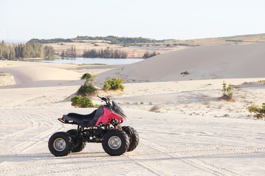 Quad bike in sand desert close-up