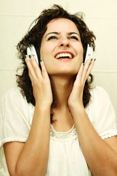 A young woman listening music with Headphones.