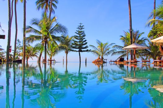 Pool on a tropical beach - vacation background